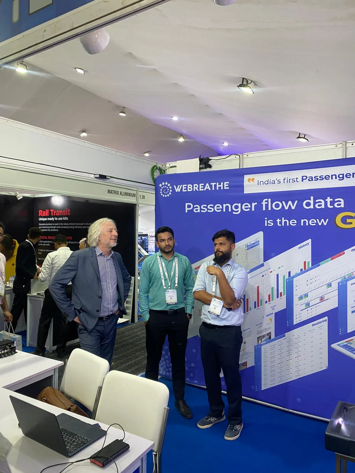 Visitors speaking at the WEBREATHE booth during Innometro