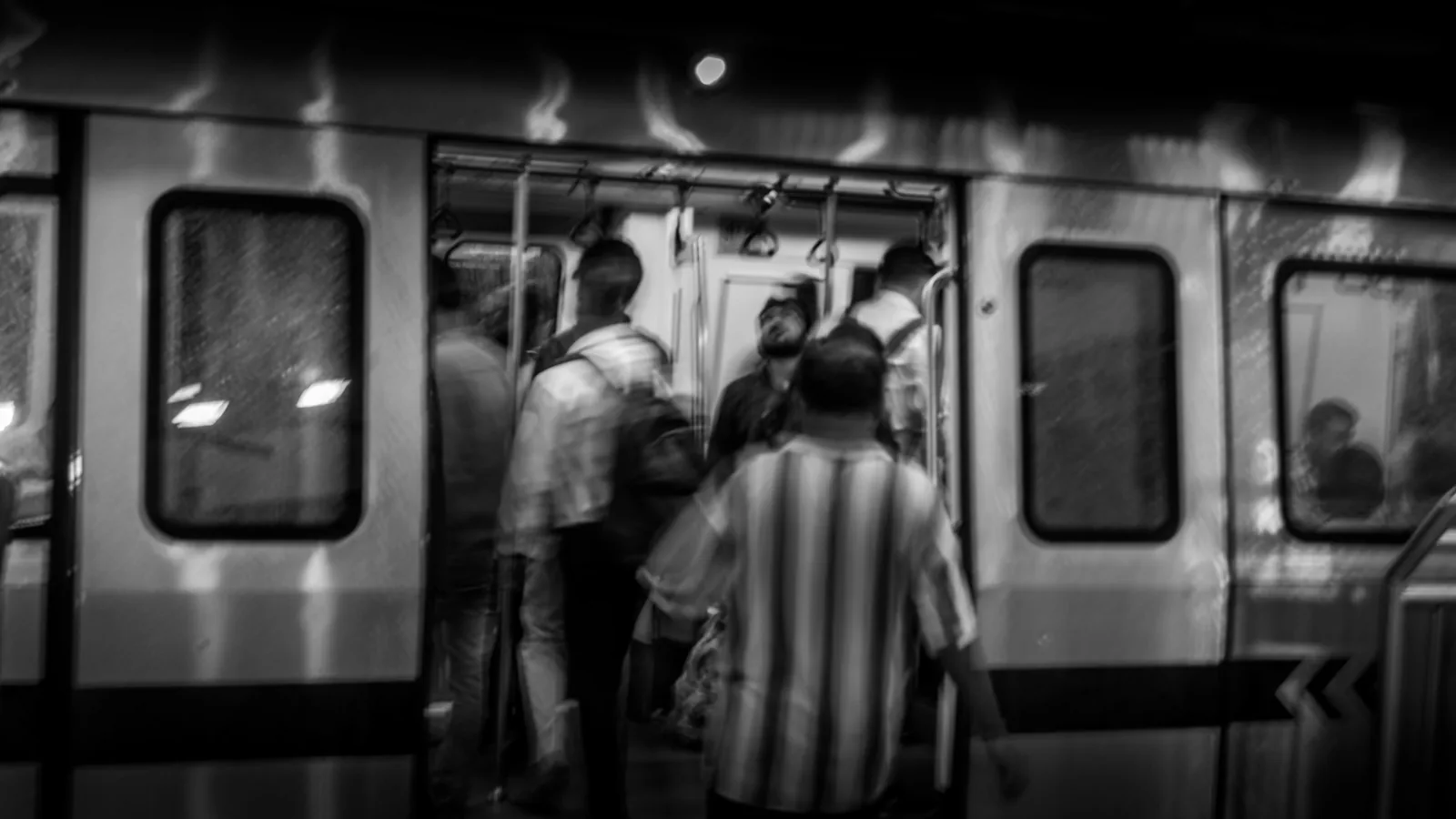 Passengers boarding a Delhi Metro train