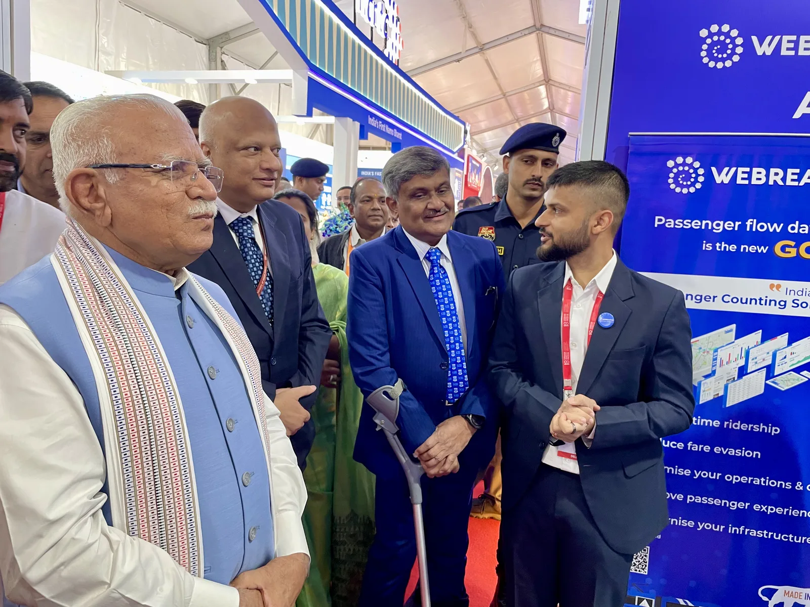 Visitors speaking with the WEBREATHE team at the exhibition